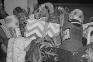 contributed photo A pile of cozy blankets will be placed within backpacks with other comfort items for the Pockets of Hope program that brings solace to foster children.