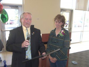 photo by Dennis Dalman At an awards ceremony April 27, Sauk Rapids Mayor Bruce Gunderson reads a proclamation in honor of Citizen of the Year Robyn Paul (right), making April 27 Robyn Paul Day in the city. The luncheon and awards ceremony took place in the Sauk Rapids Government Center. 