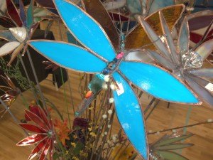 photo by Dennis Dalman A blazing-blue dragonfly is one of the many lawn-art ornaments that were featured at the Pine Groove Festival April 25 in Sartell, a fundraiser for the Sartell Music Association. 
