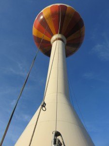 photo by Logan Gruber The water tower will be undergoing some work over the coming weeks. Just over a week ago work began, as crews closed off Tower Park while re-painting and adding some features to the water tower. Work is expected to finish around July 7.