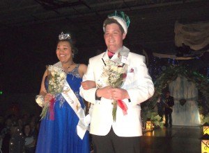photo by Dennis Dalman The Sauk Rapids-Rice High School Prom Queen and King walk the runway shortly after being coronated May 9 at the prom’s Grand March. Queen Tiara Brown and King Spencer Petrek received a thunderous ovation from the standing-room-only crowd. 
