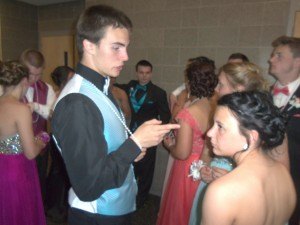 photo by Dennis Dalman Drew Anderson and Brianna Reimann chat in a group with others who just completed the Grand March at the May 14 Sauk Rapids-Rice High School Program. 