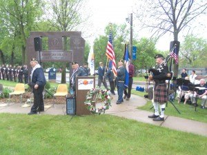 photo by Dennis Dalman Members of the American Legion prepare to post the colors at the Memorial Day ceremony May 25 in Sartell’s Veterans Park. At right is bagpiper Joe Linneman of St. Cloud. 
