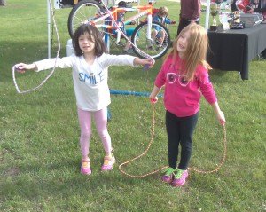 photo by Dennis Dalman Winry Richards of St. Cloud (left) and Rayna Dickhaus of Cold Spring play with their jump ropes just before the start of the Sartell Apple Duathlon. 