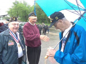 photo by Dennis Dalman Some quick buddy-bonding follows the Memorial Day ceremony May 25 in Sartell. From left to right are Rollie Weis of Sartell, who served in the Pacific in World War II; Bob Schwalboski, who served in Vietnam; and Ray Middendorf, who served in the Korean War. Weis and Schwalboski are both members of the Sartell American Legion. Middendorf is from St. Cloud. 