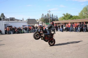 photo by Carolyn Bertsch One of the highlights at the last stop of the Ride for Cody was the several stunts performed by SquidWheelies Motorcycle Stunt Team member Jason Larson of Sauk Rapids.