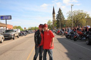 photo by Carolyn Bertsch Cody's parents, Lorraine Hipp and Ryan Nuckolls of St. Joseph stand in front of 100+ motorcycles which were driven in support of Cody.