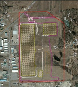 contributed image The distribution center's layout can be seen here: the red outline is the edge of the parcel they are proposing to purchase; the yellow, shaded areas are where buildings would lie; and, the white outline is where roads and parking lots would be.