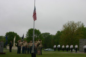 photo by Steven Wright Boy Scouts from Sauk Rapids Troop 9 salute the flag, prior to the Memorial Day Ceremony on Monday.