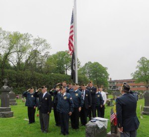 photo by Cori Hilsgen Members of the American Legion Post 328 of St. Joseph salute the American flag as the Star- Spangled Banner, our country's national anthem is played. 