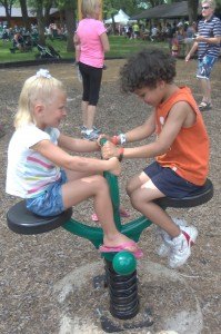 photo by Dennis Dalman Nora Ferber of Lakeville has fun with her newfound friend, Christopher, at the Sauk Rapids River Days Food Fest. Nora was visiting her St. Cloud grandparents, Ken and Joan Ferber, and they all decided to go to River Days to cool off and have a good time.