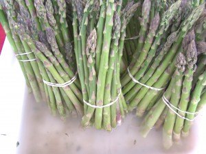 photo by Dennis Dalman Bundles of asparagus await buyers at the Sartell Farmers’ Thursday Market.