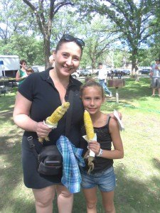 photo by Dennis Dalman Cynda-Rhea Gorshe and her mother, Lisa Gorshe of Richfield enjoy corn on the cob at River Days Food Fest in Sauk Rapids June 27. Cynda-Rhea was visiting her grandmother last weekend in Sauk Rapids at the time of the food festival.