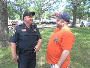 photo by Dennis Dalman Sauk Rapids Police Officer Tim Sigler and Sauk Rapids resident Jeffrey Vogel share a few laughs at River Days Food Fest in Sauk Rapids June 27.