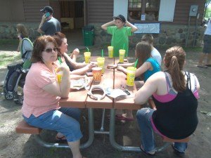 photo by Dennis Dalman A picnic bench filled with lemonade cups evokes what a warm but pleasant summer day it was at River Days Food Fest in Sauk Rapids June 27.