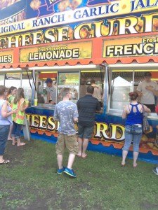 photo by Dennis Dalman Lines formed all day and into the evening at the perennially popular Cheese Curd shop at River Days Food Fest. The curds were just one kind of many dozens of finger foods served at the annual festival.