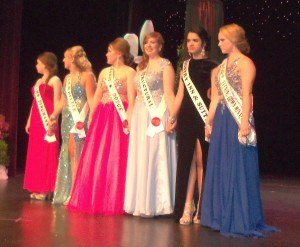 photo by Dennis Dalman  The ambassador candidates line up on-stage as the Ambassador Pageant gets underway June 25 at Sauk Rapids-Rice High School. From left to right are Marissa Leeb, Nikki Bukowski, Tana Henrickson, Sydney Miller, Patricia Cazalvilla Torres and Kelsey Christensen. 