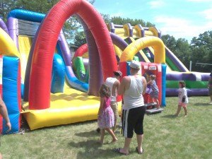 photo by Dennis Dalman Children have a blast on the inflatables at River Days Food Fest.