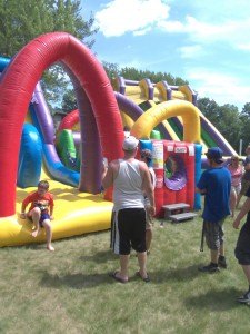 photo by Dennis Dalman Children have a blast on the inflatables at River Days Food Fest.