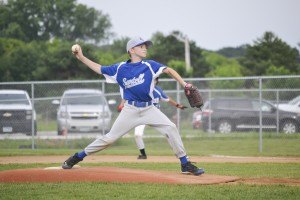 photo by Hannah Marie and Myles B. Photography Jackson Vos (#26, age 11, pitcher) of Sartell, delivers a pitch in the Sartell vs Brainerd middle school game.