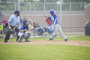 photo by Hannah Marie and Myles B. Photography Brayden Lenzmeier (Age 13, #19, Catcher, parents Jill & Paul) of Sartell, swings big at a pitch in the Sartell vs. Brainerd Middle school game.