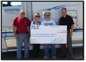 contributed photo Fifteen-year truck- driving veteran James Simon (third from left) with Kevin and Bonnie Weisser, co-owners of Weisser Trucking Inc. in St. Joseph (left) and Tim Coughlin, president and CEO of TLC Cos. Simon was recently named TLC's 2014 Top Dog, which earned him a $10,000 award.