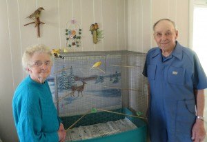 photo by Cori Hilsgen Rita and Maurice Palmersheim talk about their pet canary named "Happy." The Palmersheims have had many pets throughout their 66 years of marriage, including a pet deer. 