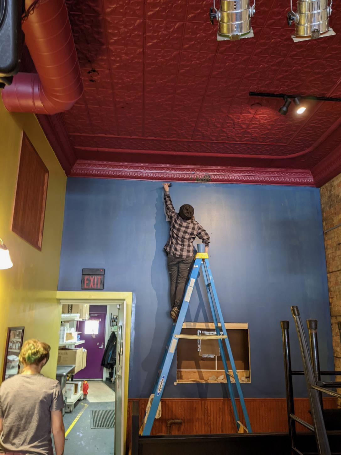 Contributed photoThe Local Blend renovation project Jan. 1 - 8. Owner Stacie Stone adds a fresh coat of blue on the back wall